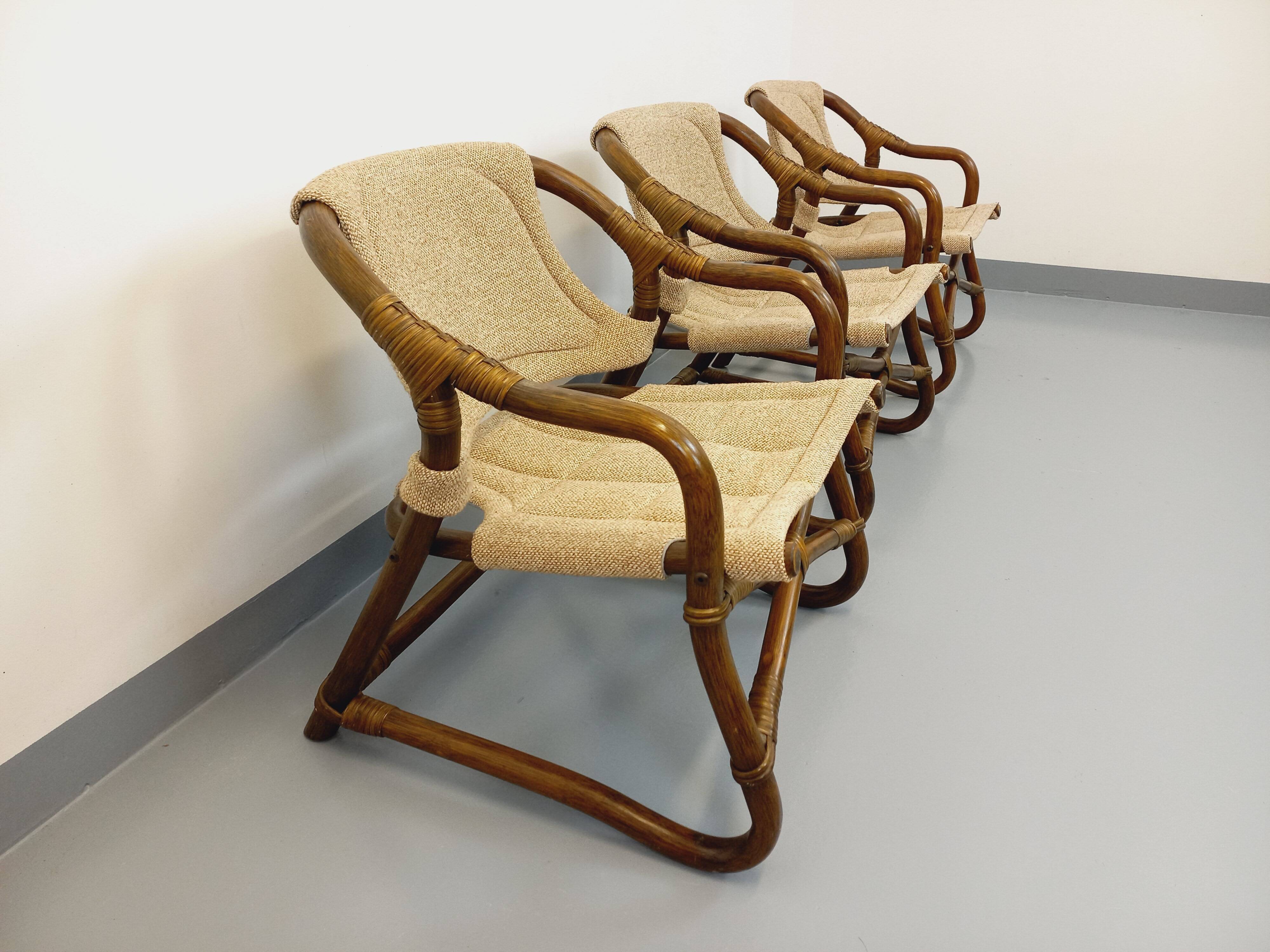 Set of 3 vintage Danish safari-style armchairs from Horsnæs Møbelfabrik in rattan and fabric from the 1980s.