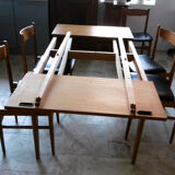 Table with two extensions and its 6 chairs scandinavian teak of the 1970s