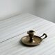 Brass candle holder with handle.