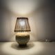 Vintage ceramic lamp with wicker and cotton shade.