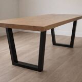 Modern table with metal legs and a natural varnished solid oak top