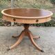 Round extendable table in Empire style, renovated with Bordeaux leather and raw wood, 168cm.