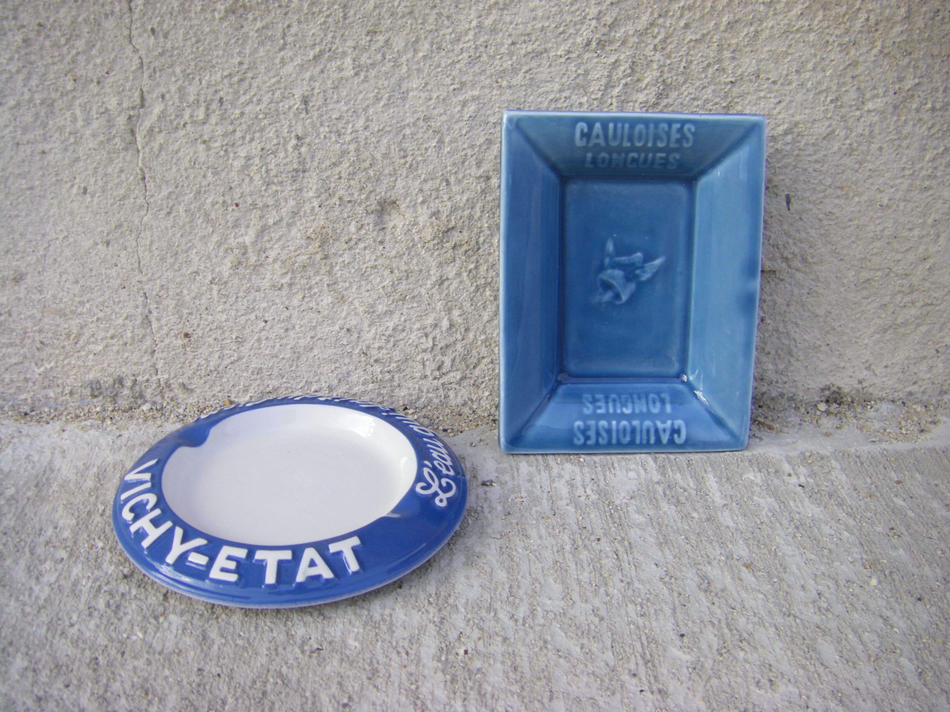Two advertising ashtrays