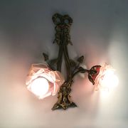 Pair of bronze wall sconces decorated with 2-armed knots with purple tulips Signed DP. 1940s