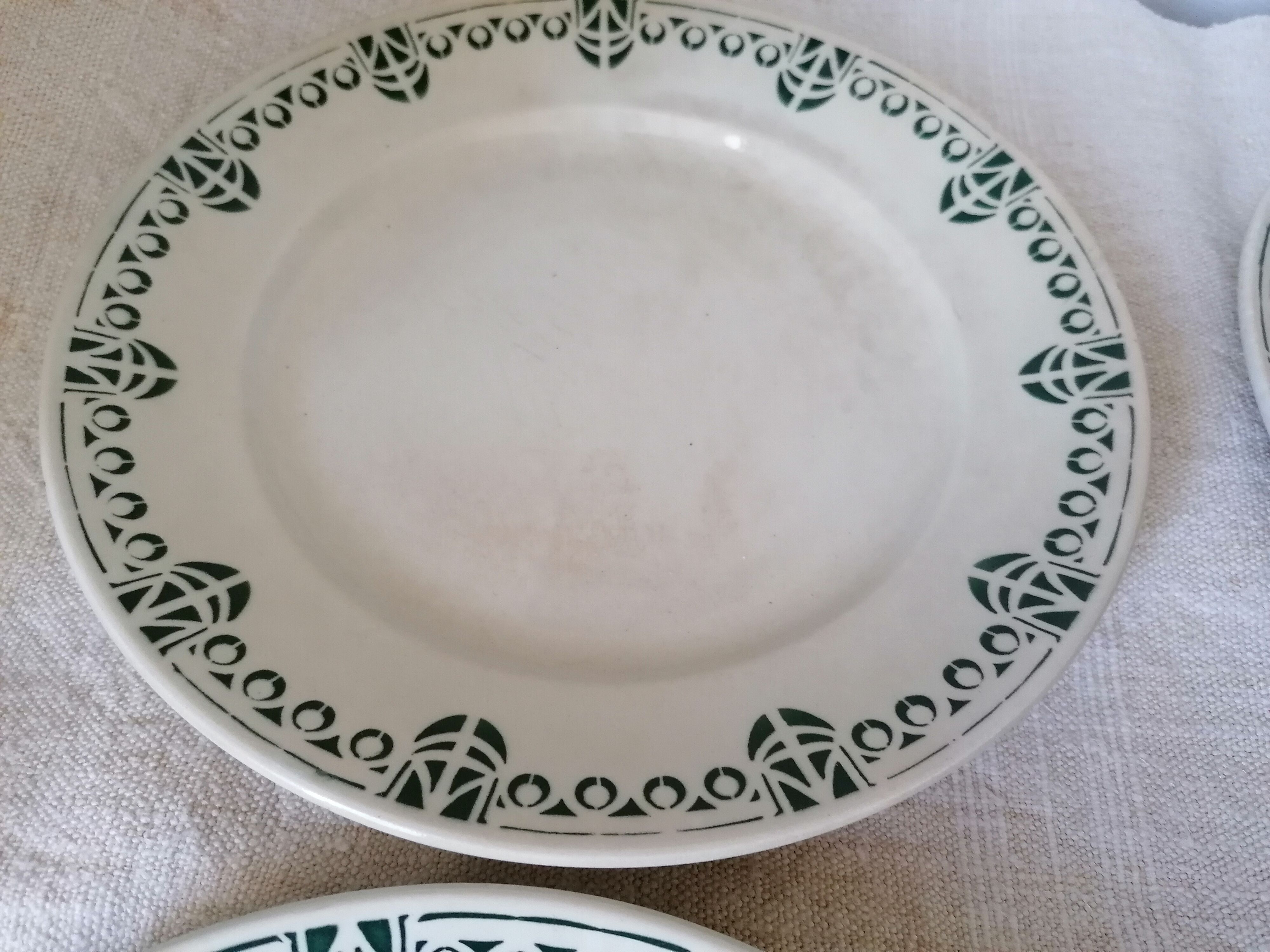 Set of 11 flat earthenware plates