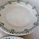 Set of 11 flat earthenware plates