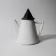 Vintage ceramic coffee pot or teapot from the 1980s, postmodern Memphis design, black and white triangles.
