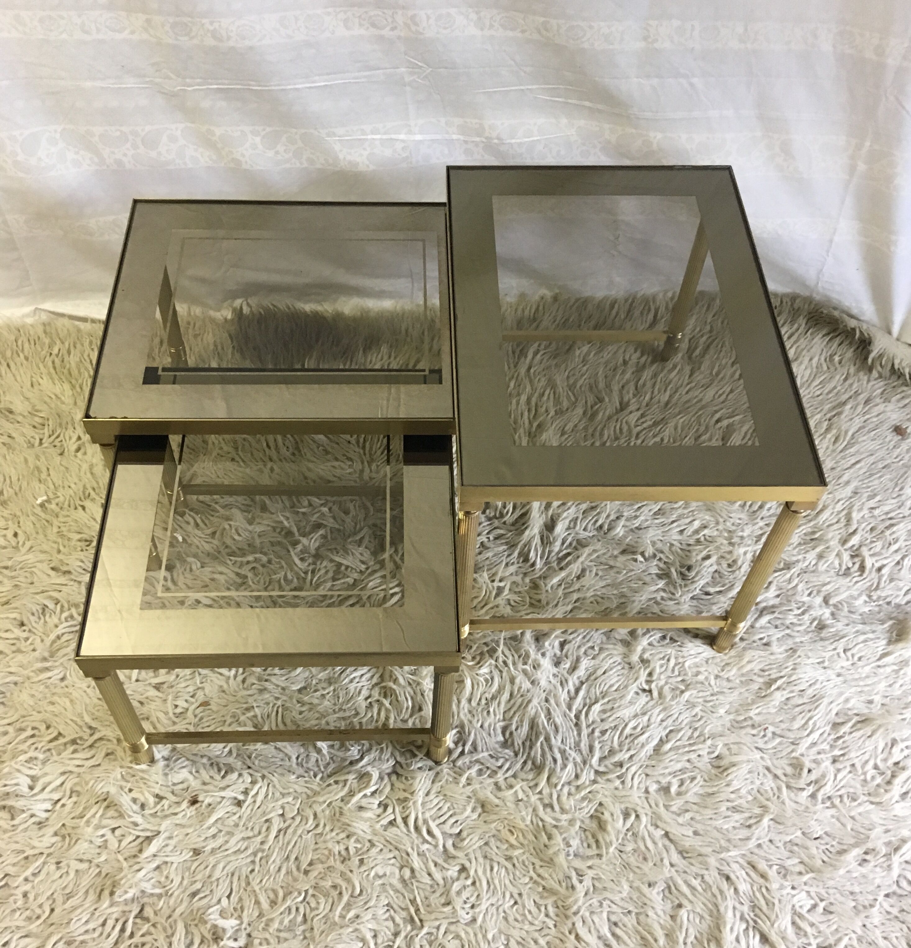 Brass and glass pull out tables 70