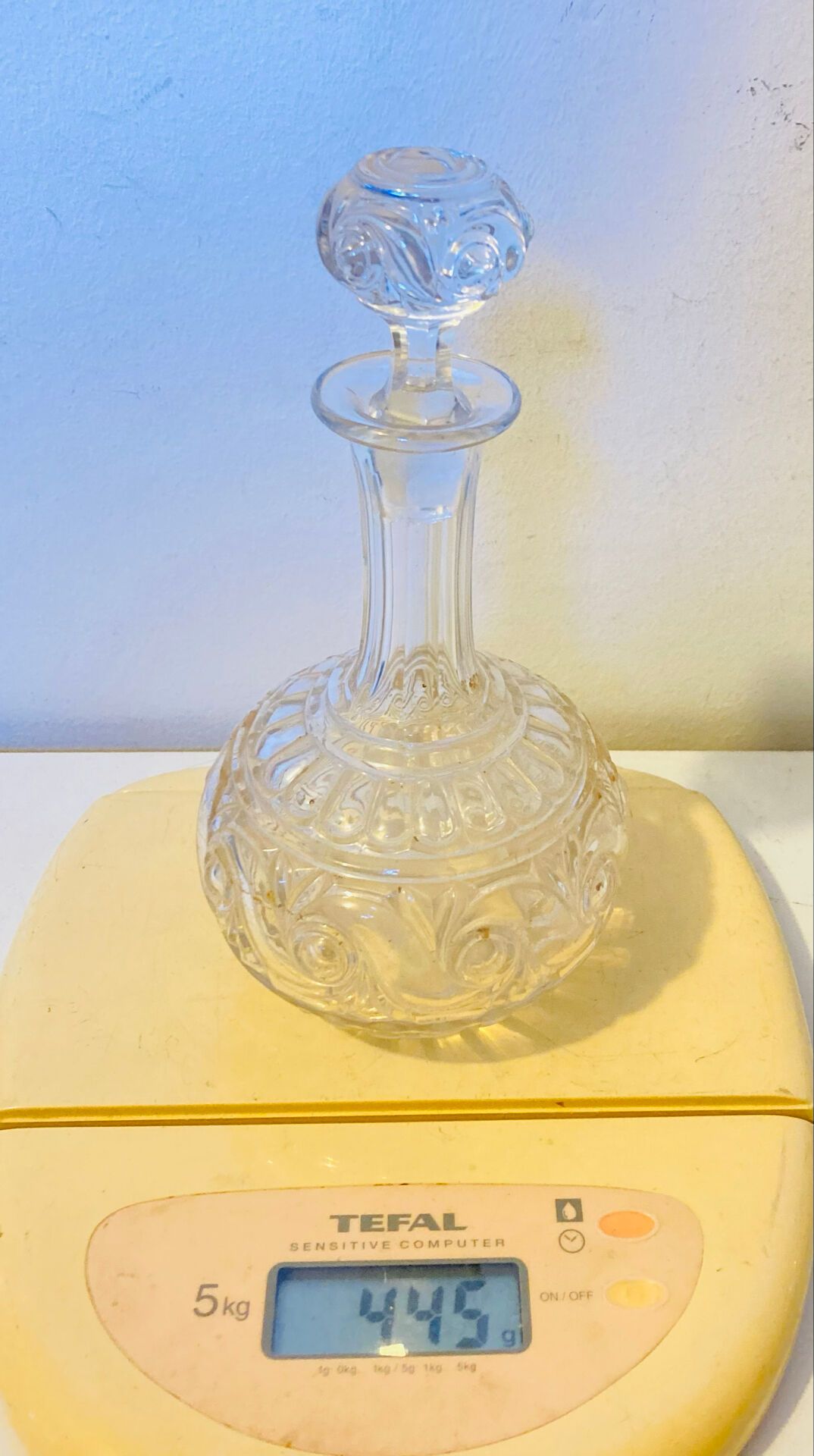 19th-century liqueur carafe in glass adorned with relief patterns.