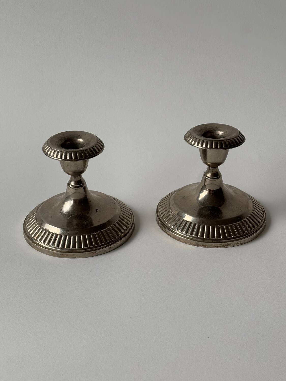 Antique silver-plated metal candlesticks