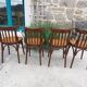 4 bentwood bistro chairs with a pattern on the seat
