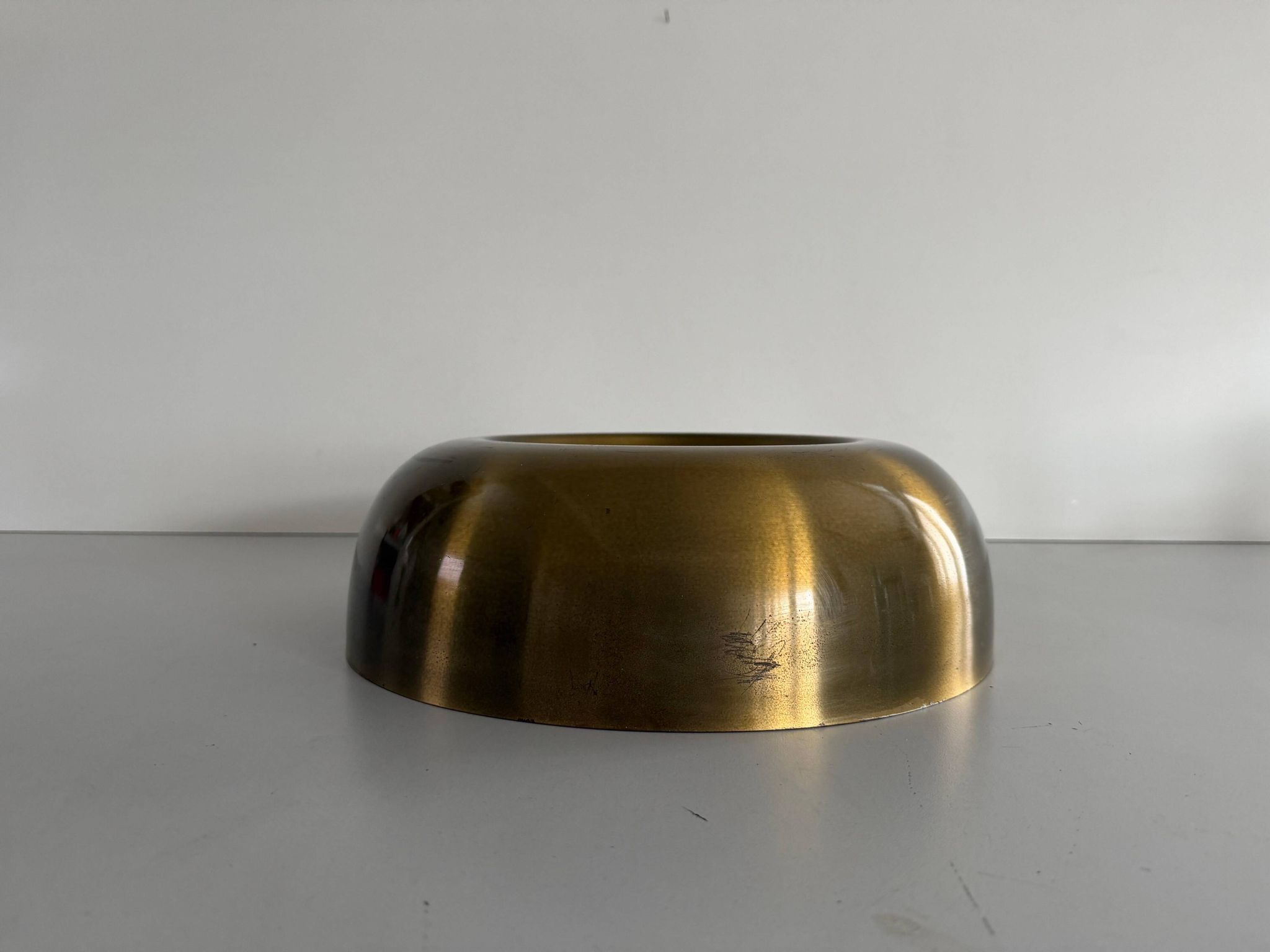 Flush-mounted disc-shaped brass fixture from the mid-century, 1960, Italy.