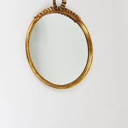 Round wall mirror in gilded wood, mid-century, C. Allodi & G. Subelli, Italy, 1950s.