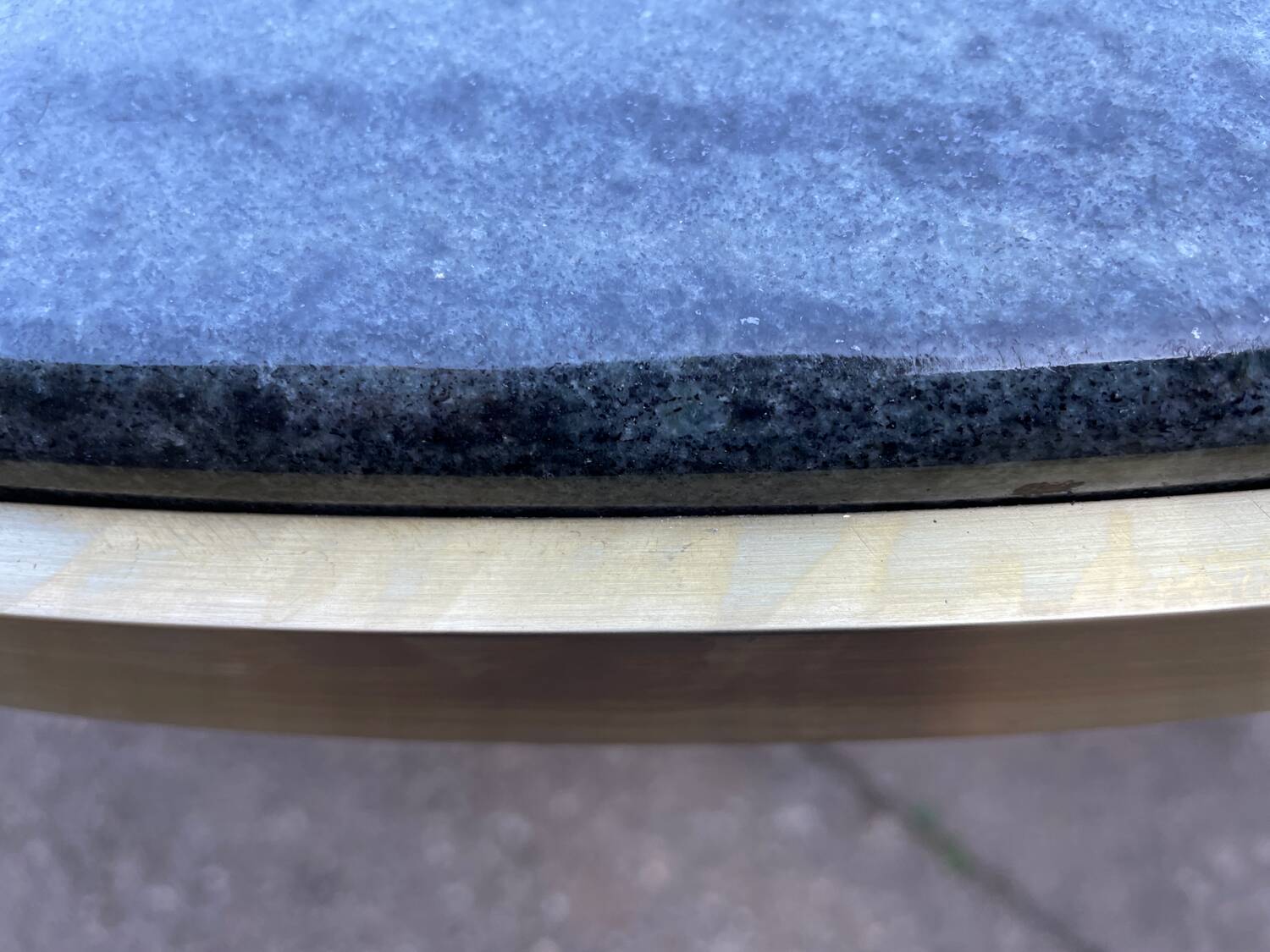 Round dining table with green marble and solid brass.