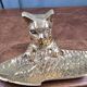 Vintage cat fish catchall in brass on a solid wood base.