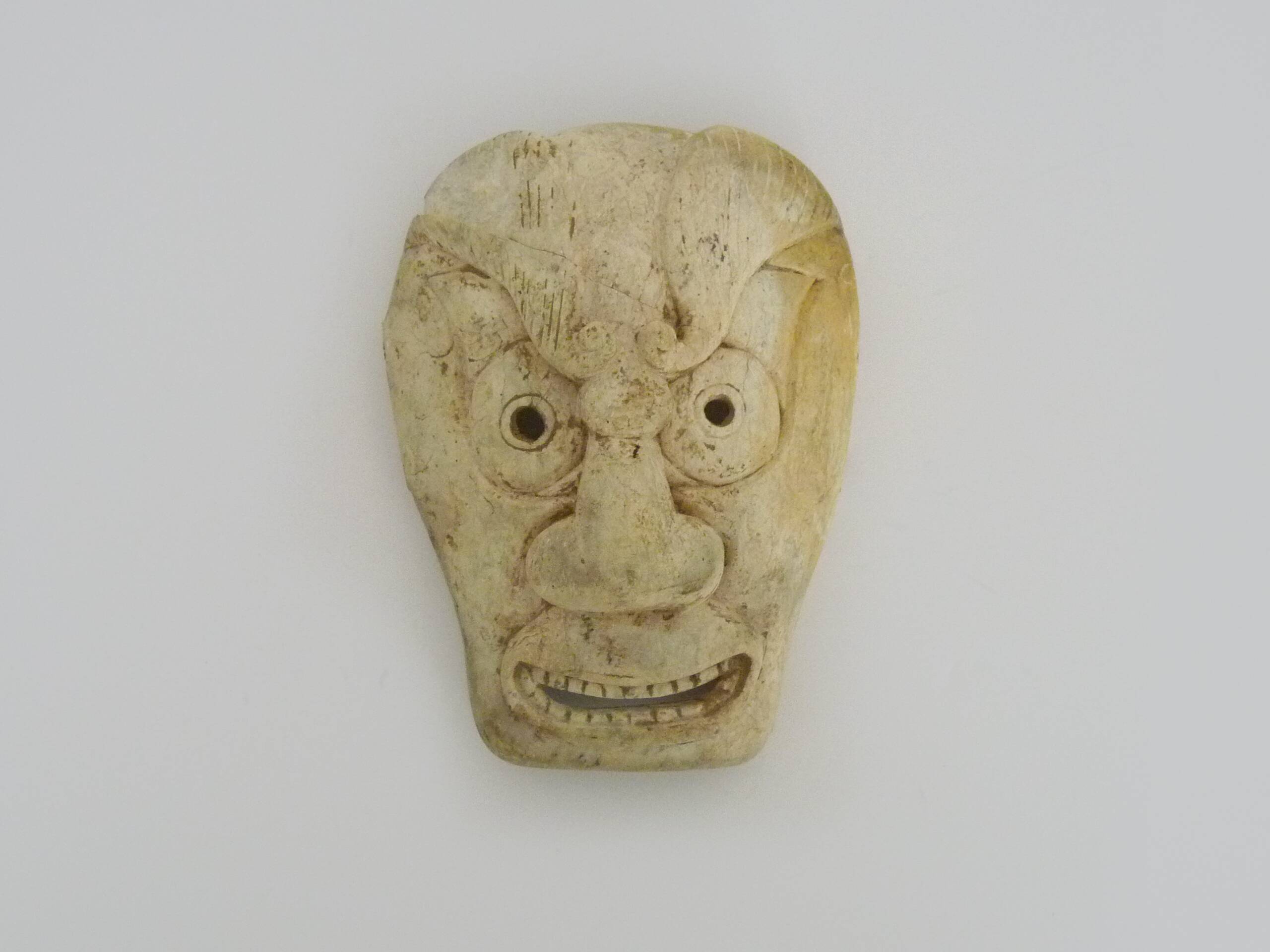 Netsuke old large bone mask japan grimacing character. 19th century