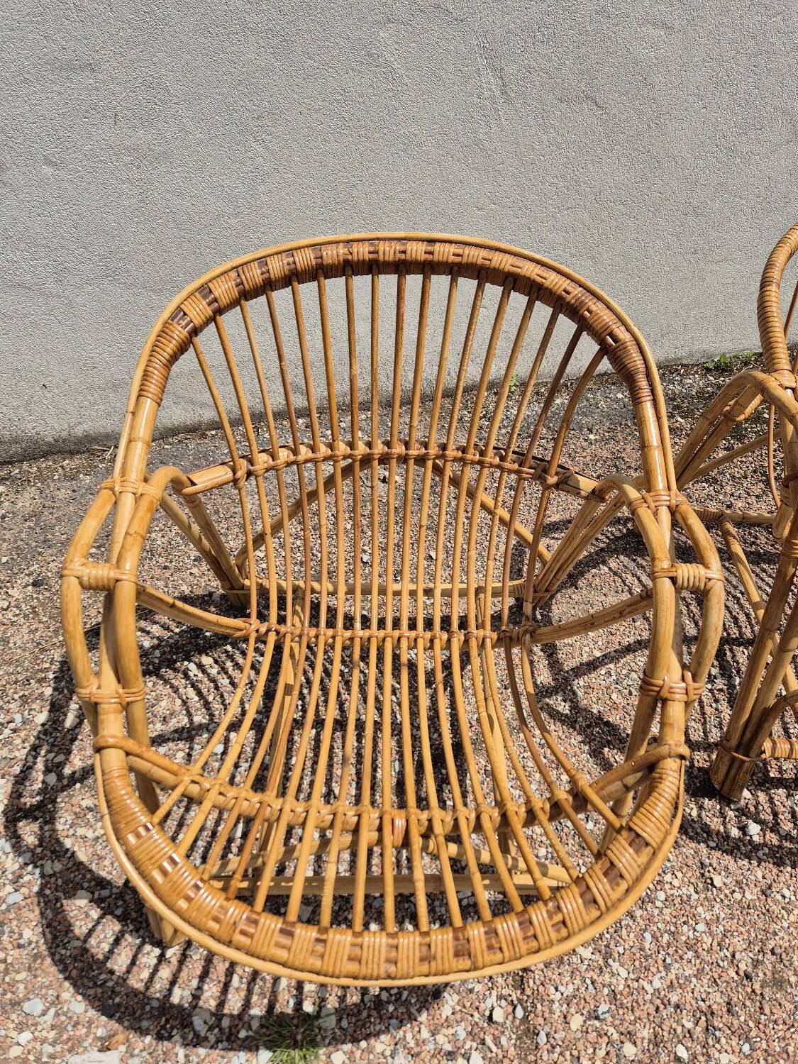 Rattan lounge with two armchairs and a vintage 1950s bench.