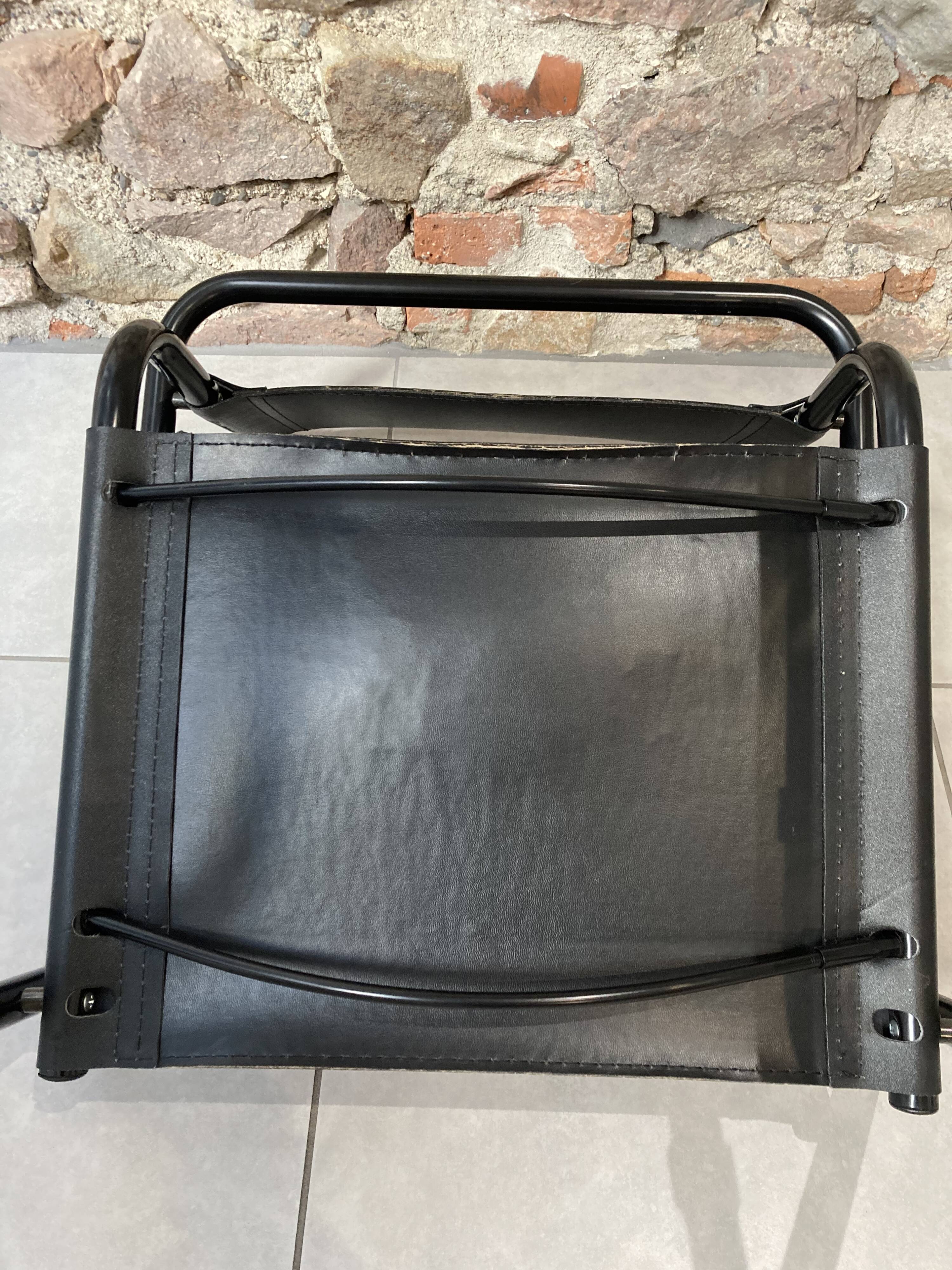 Armchair in black lacquered metal