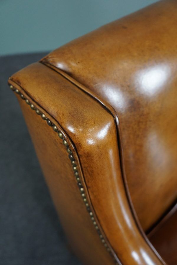 Modern charming armchair in sheepskin