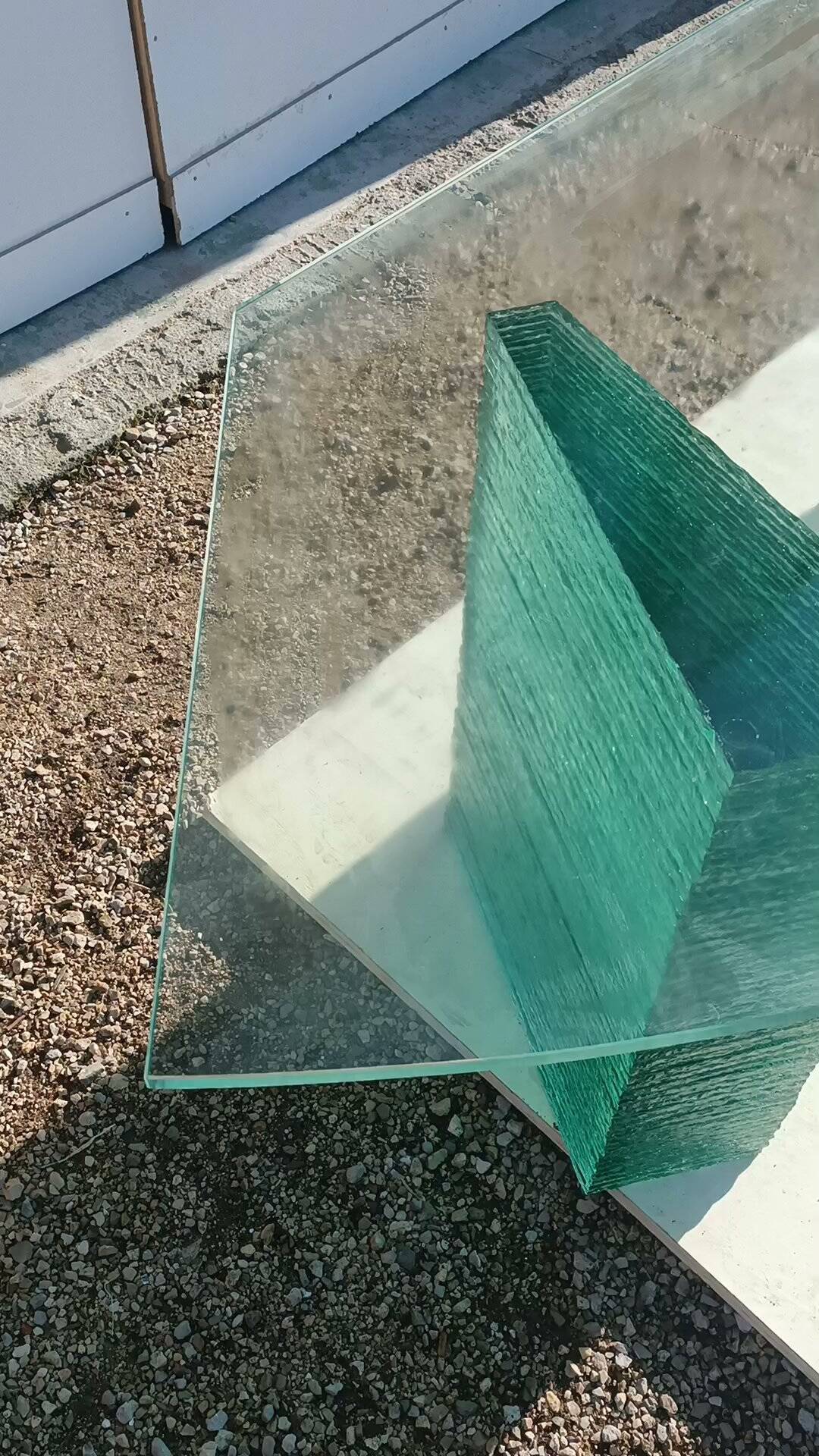 Solid glass desk with a half-moon top.