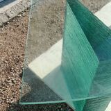 Solid glass desk with a half-moon top.