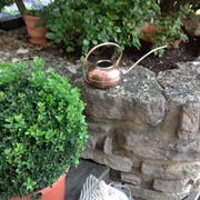 Red copper watering can in Scandinavian style 60s-70s