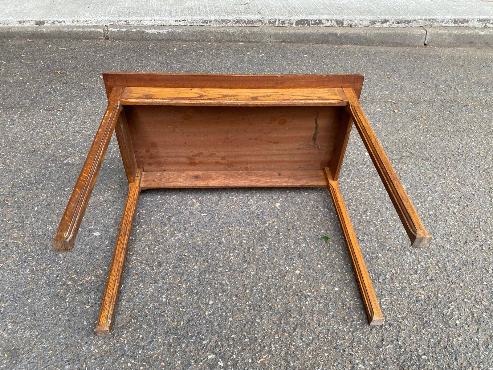 Vintage rectangular side table in solid oak from the 1920s.