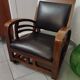 Leather and teak armchair