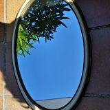Old oval guilloche mirror, gilded and painted