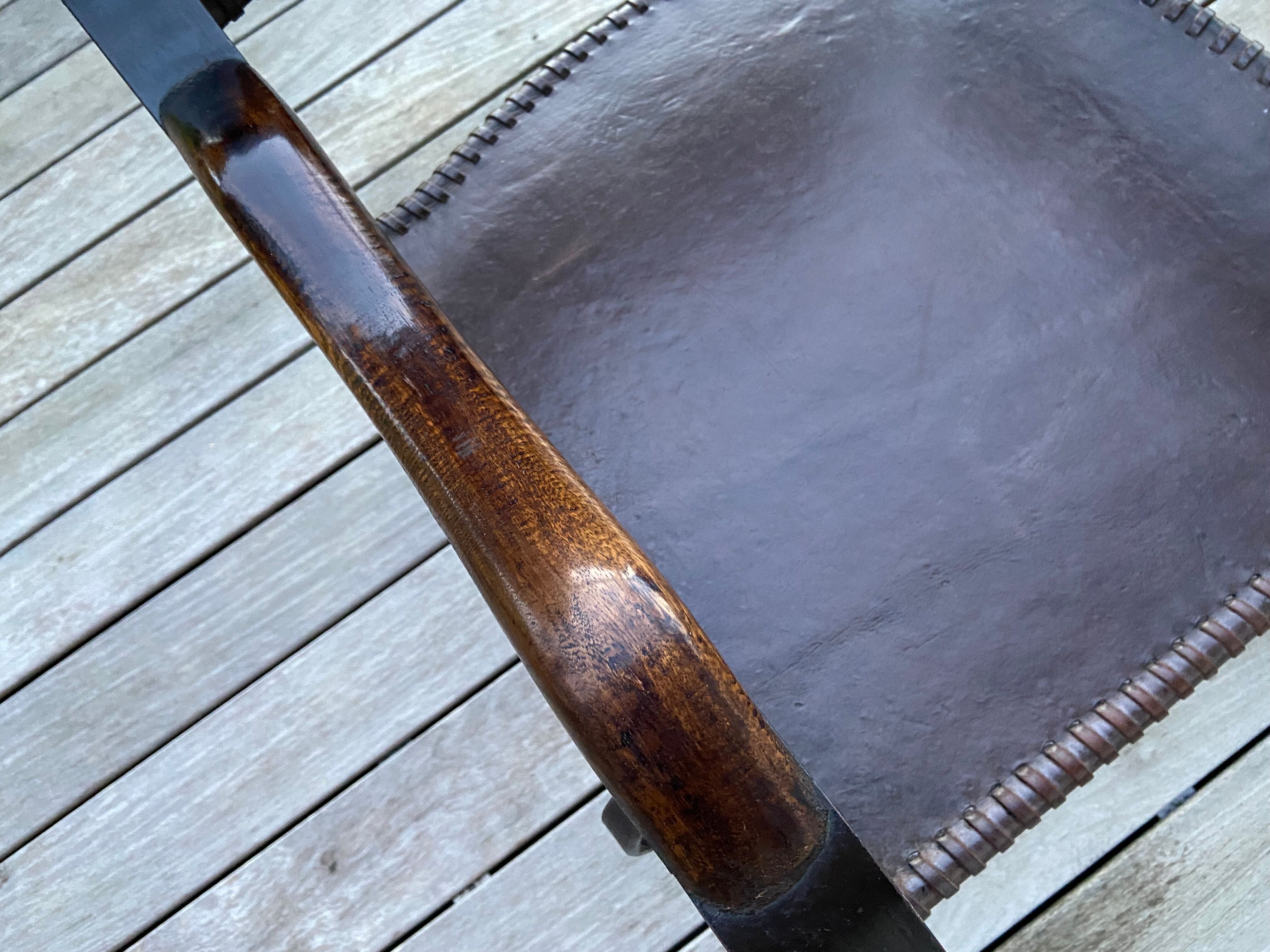 Leather and wrought iron armchairs