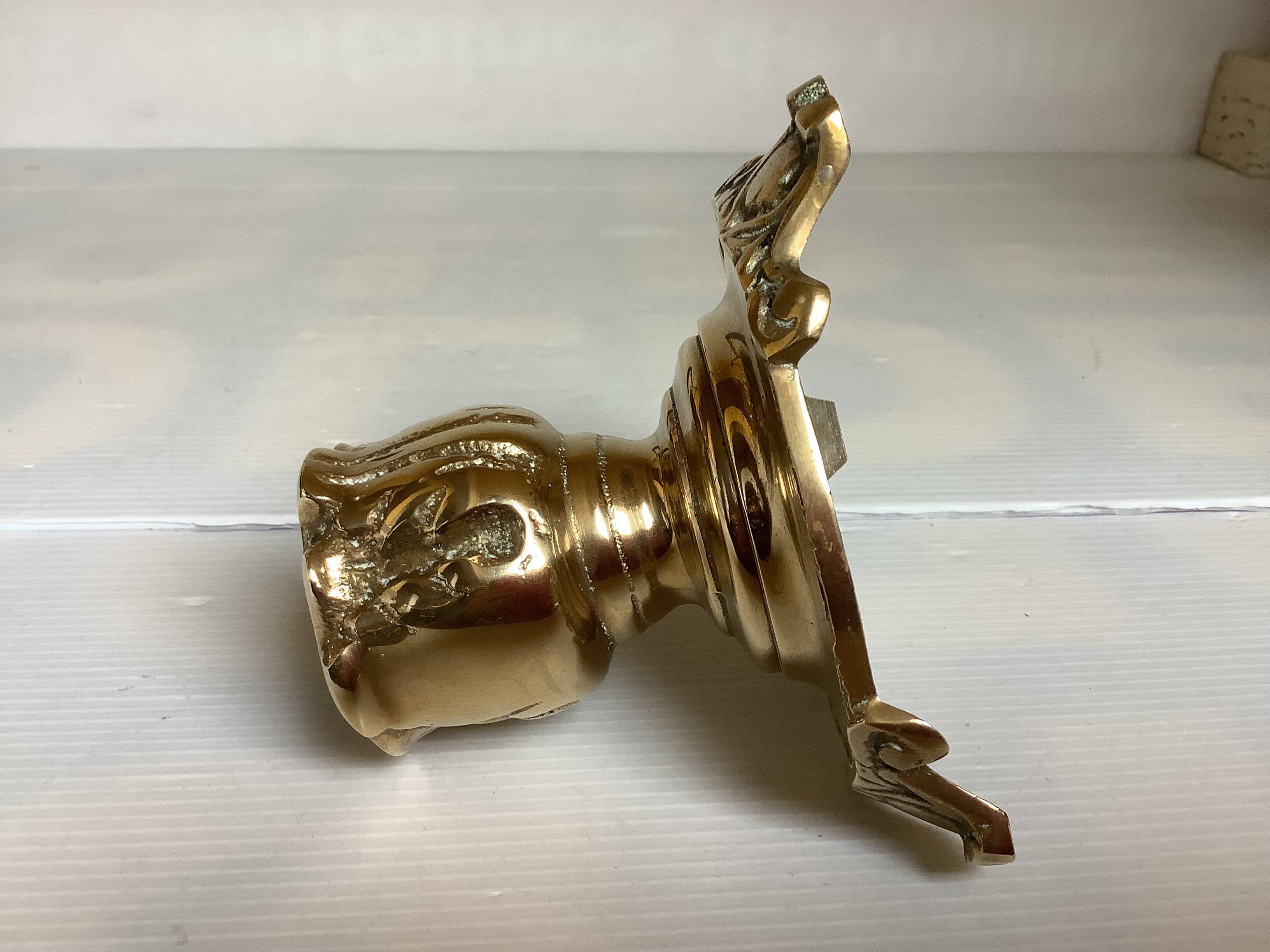 Tripod candlestick in worked bronze