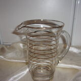 Service in glass pitcher and 10 glasses