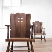 Pair of brutalist oak lounge chairs with rush seats, circa 1935
