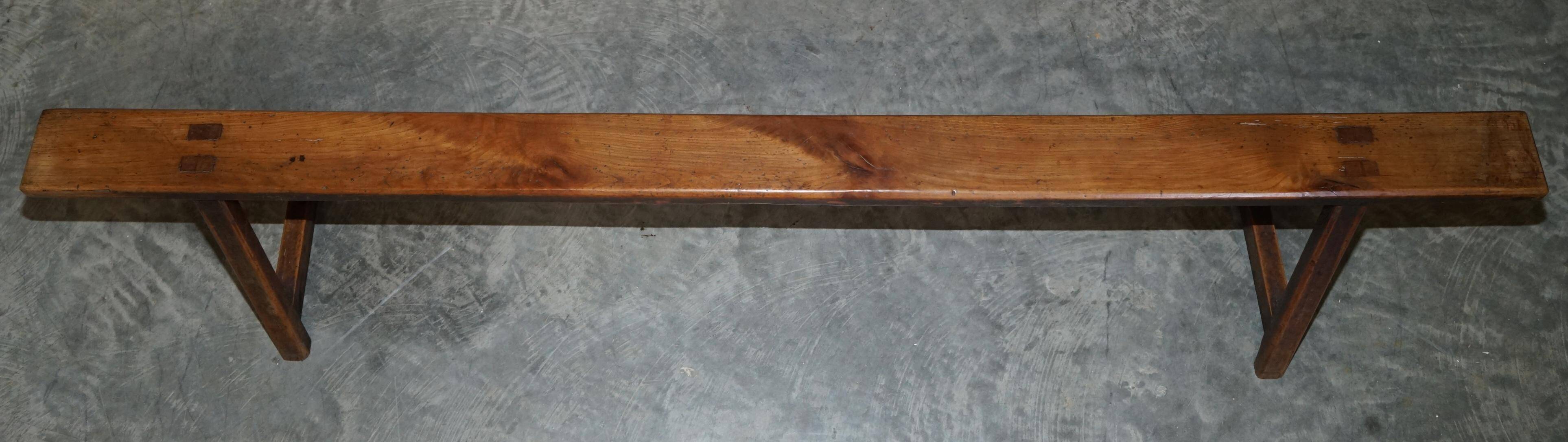 Pair of antique Victorian trestle benches in fruitwood.