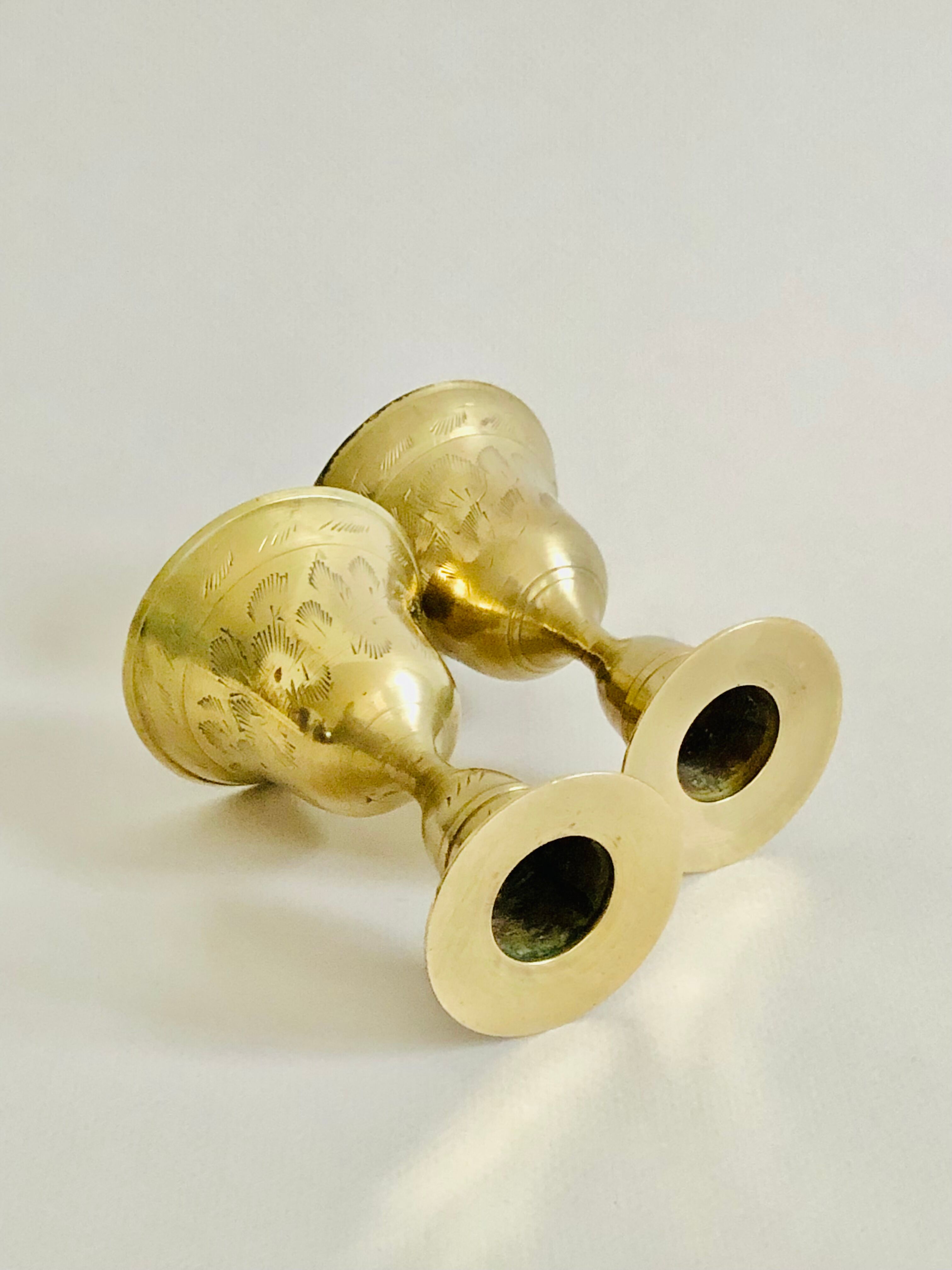 Pair of brass "bell" candle holders