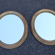 Paire de miroirs ovales en bois doré époque Louis Philippe