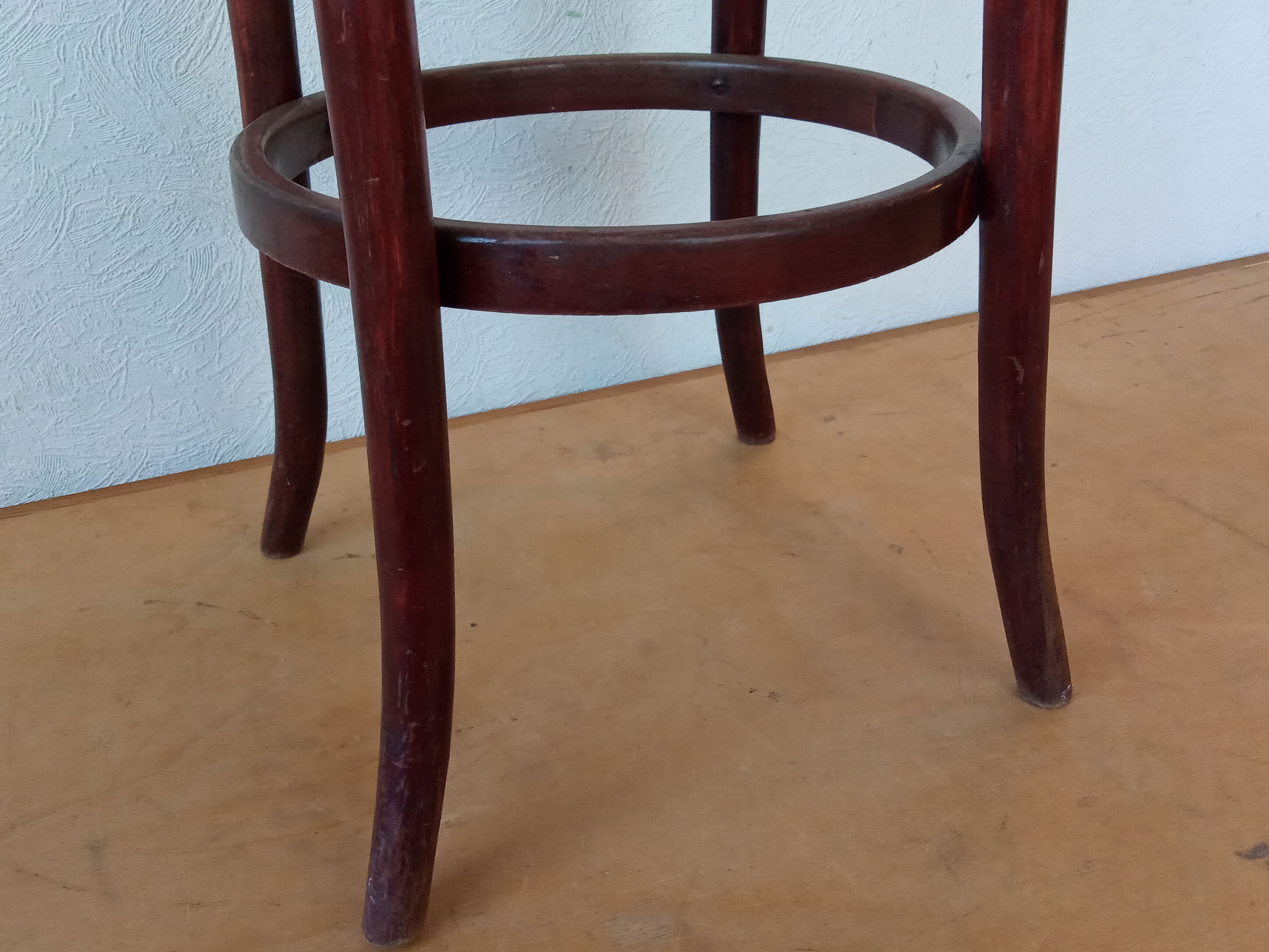 Curved wooden bar stool