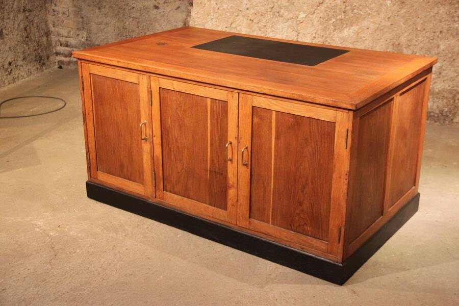 Double administrative desk with cupboard and drawer.