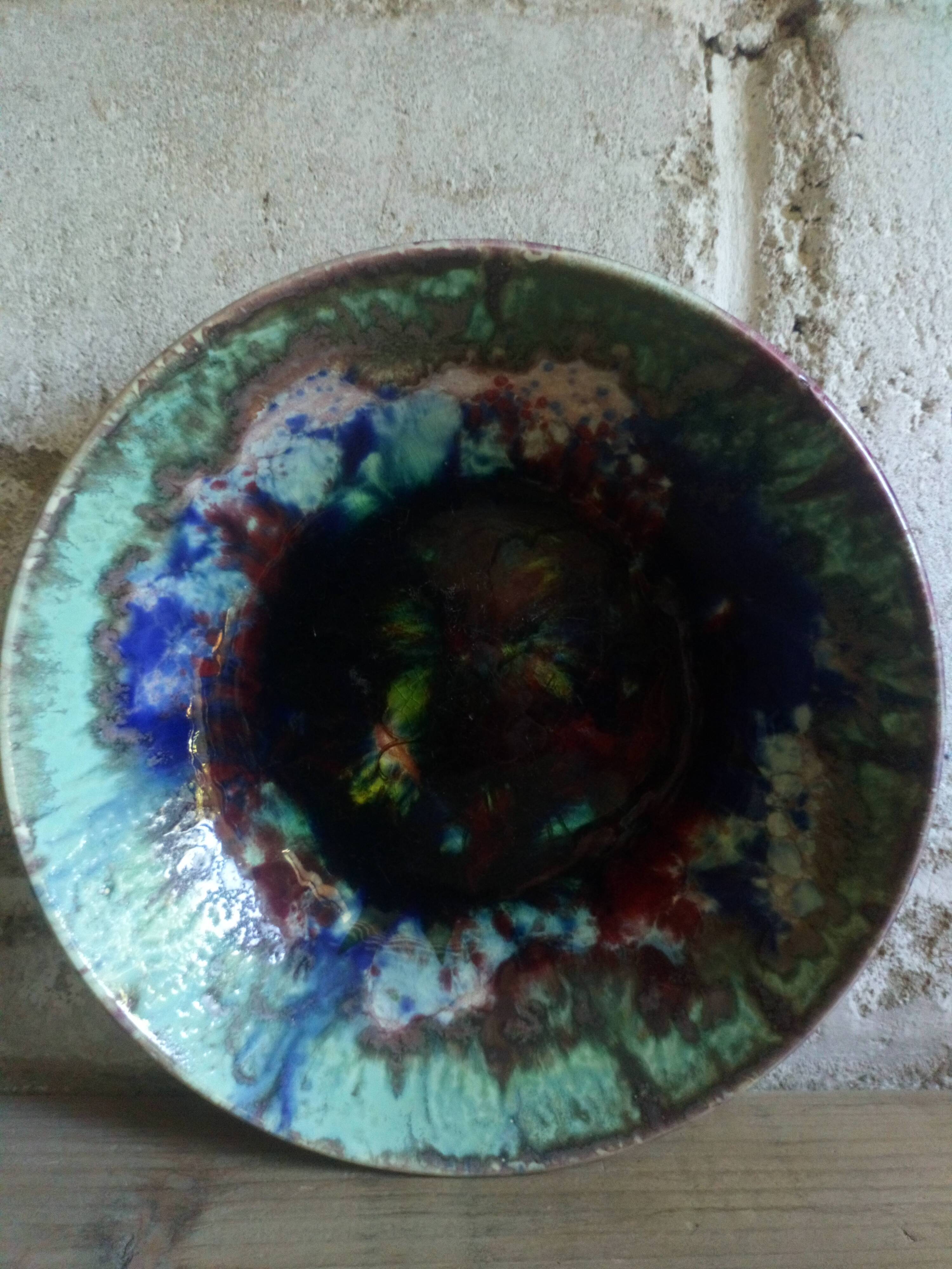 Seven plates of potter with multicolored enamels