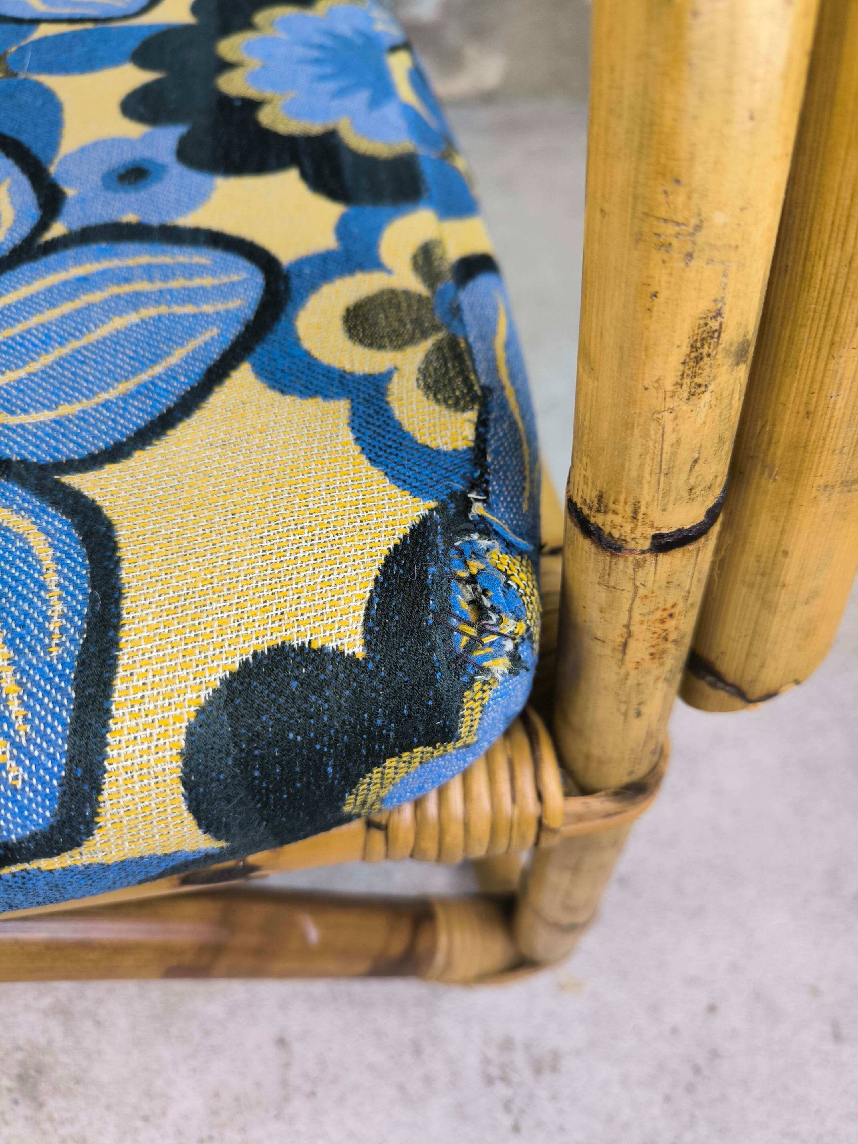 Vintage armchair in rattan and floral fabric