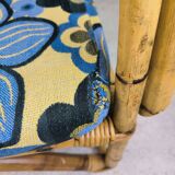 Vintage armchair in rattan and floral fabric