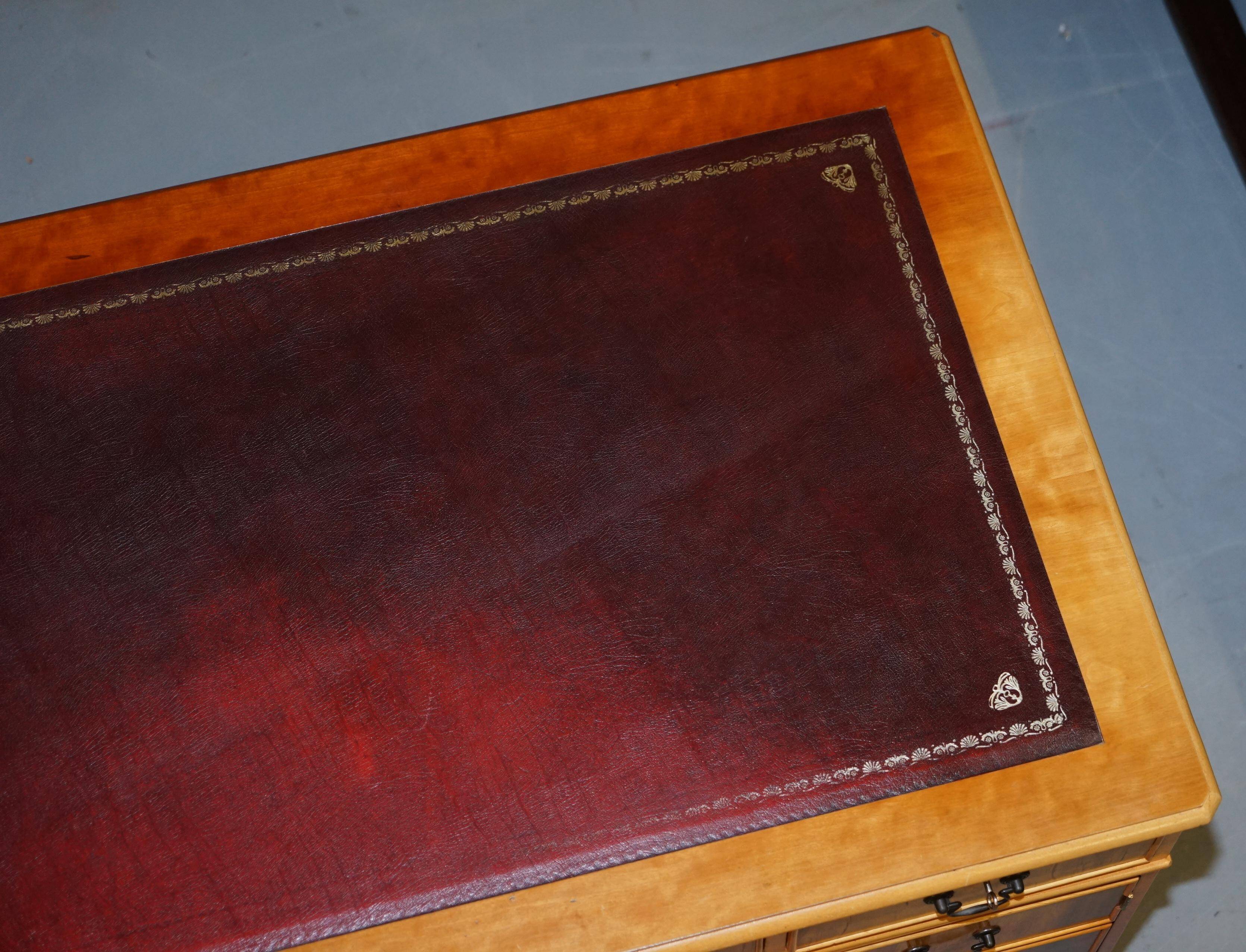 Vintage satin wood partner desk with leather top.