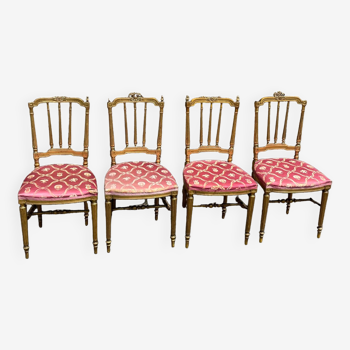 4 chaises  en bois sculpté, dorée à la feuille