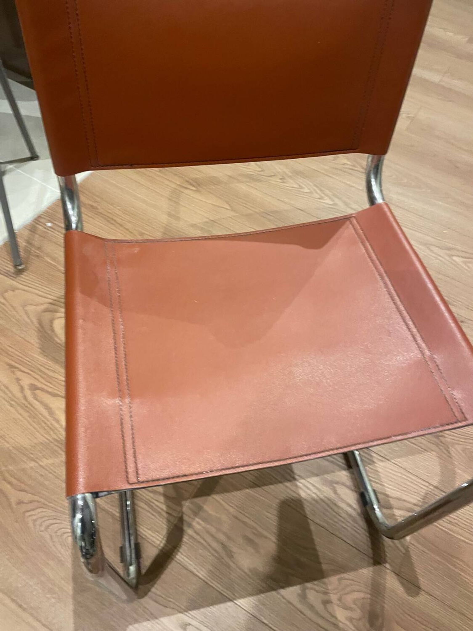 Hanging chair in Mart Stam S33 style in chrome metal and cognac imitation leather