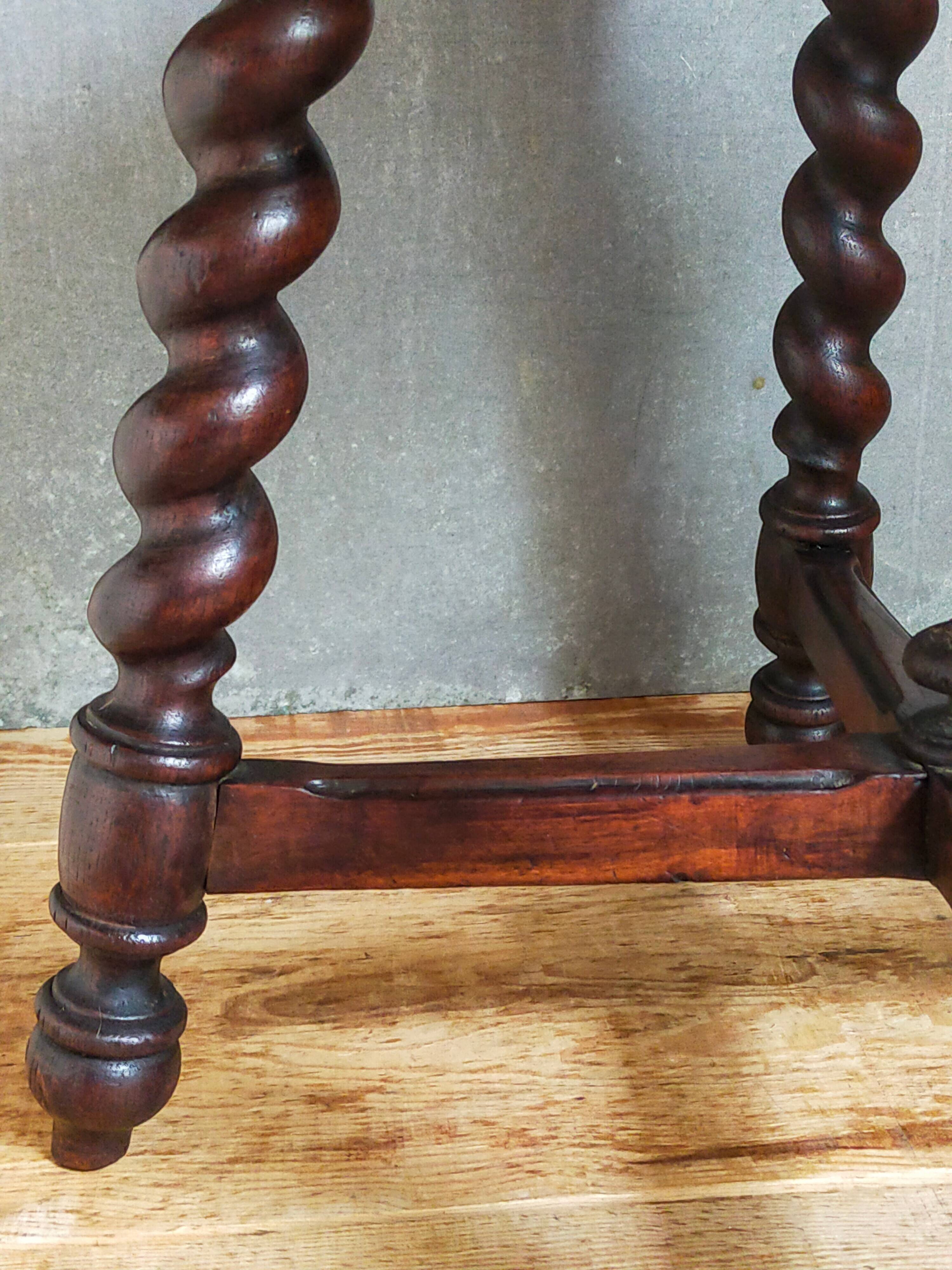 Antique stool in turned and carved solid wood