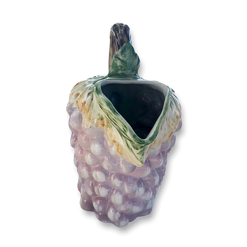 Old bunch pitcher of dabbling grapes