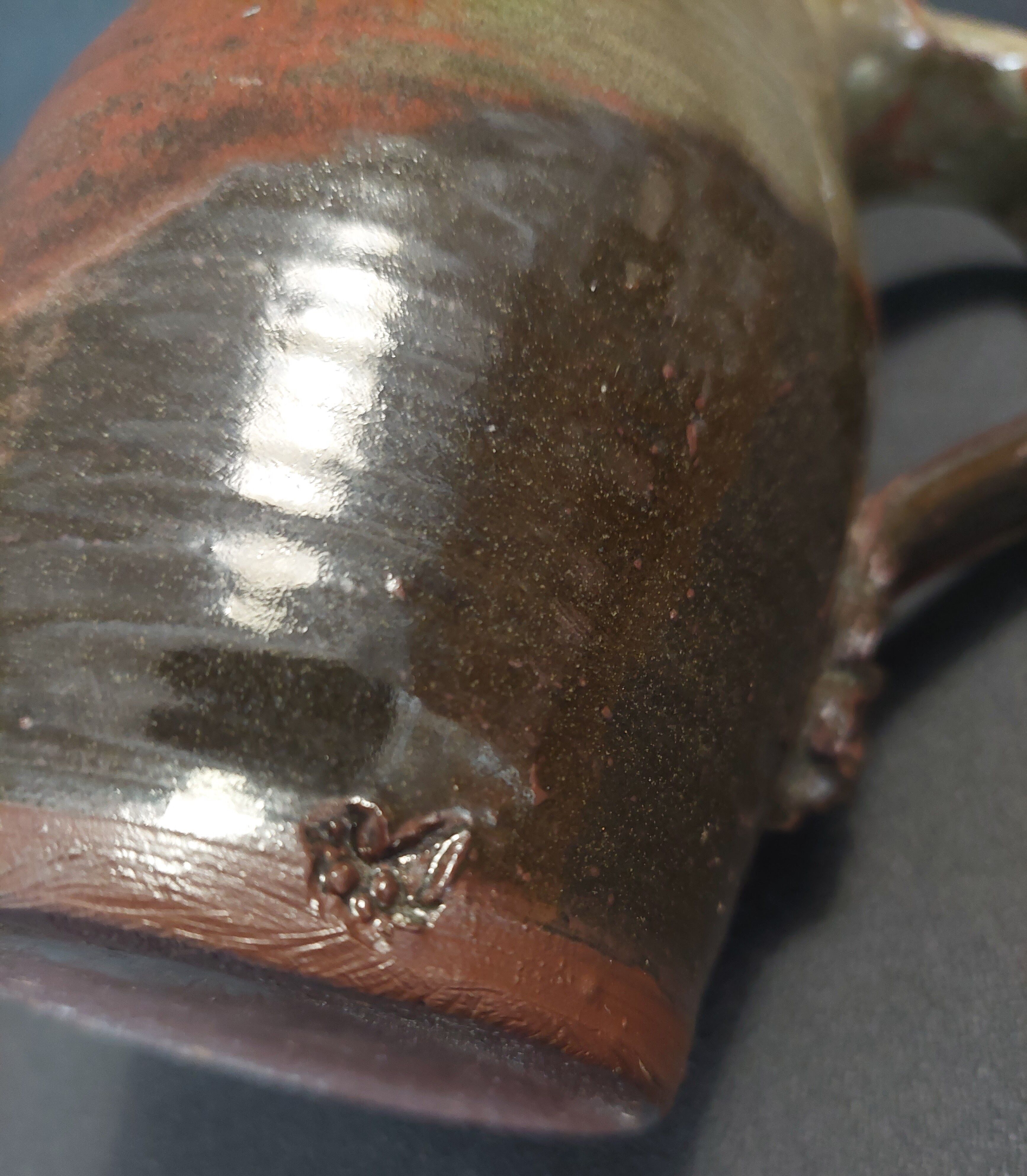 Ceramic pitcher from the 20th century with a signature to identify.