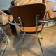 Armchair with armrests from the 70s in Skai and chrome.