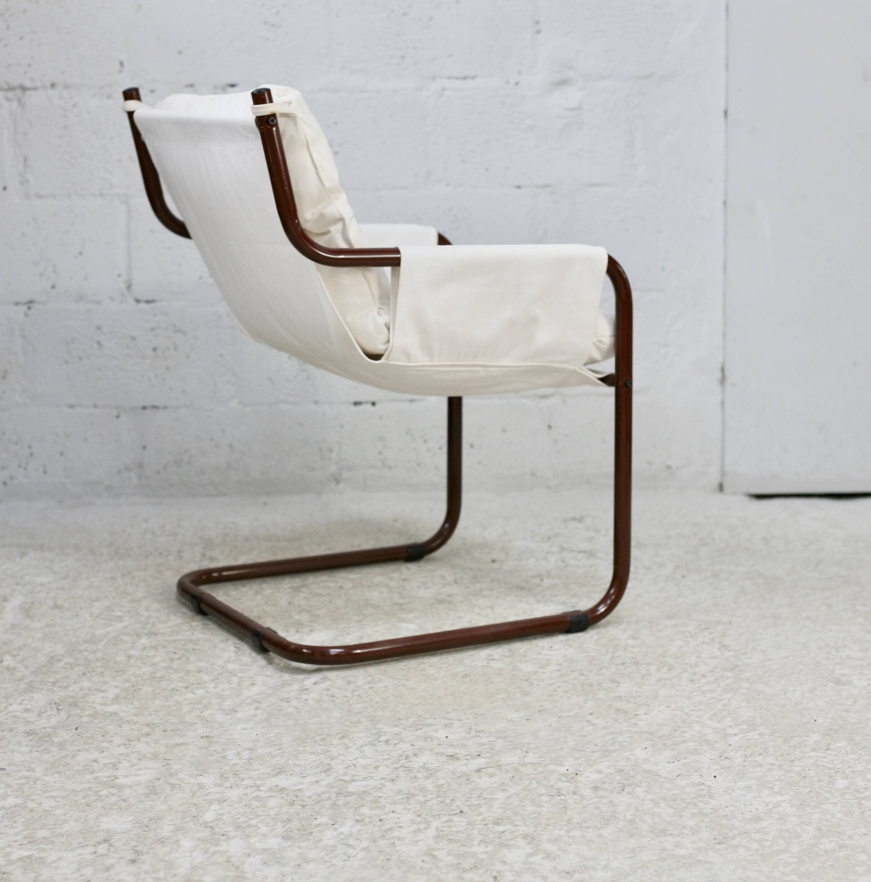 Tubular armchair, fabric suspended seat. Circa 1970