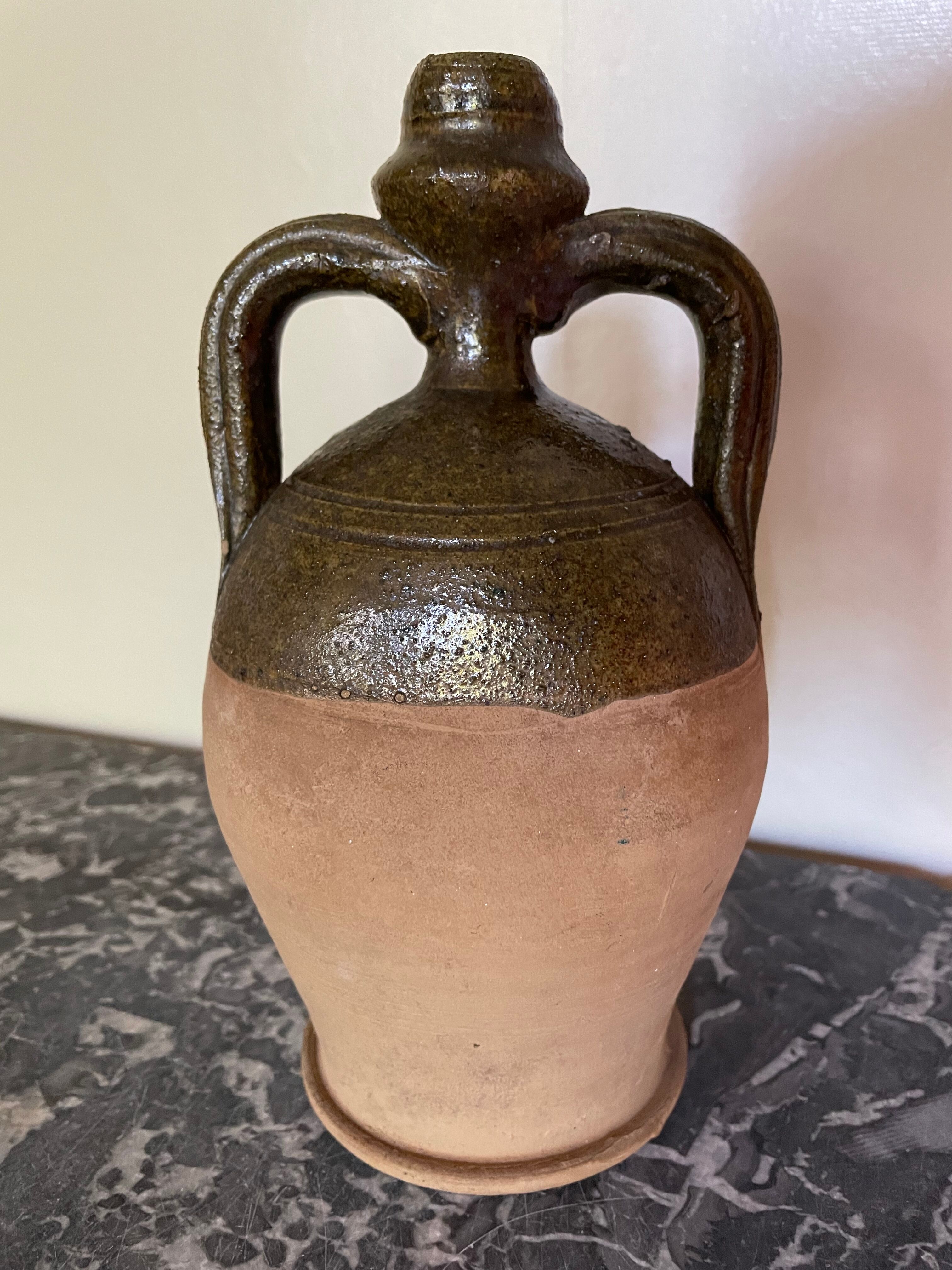 Persimmon glazed terracotta oil jar